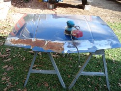Rusty hood before.