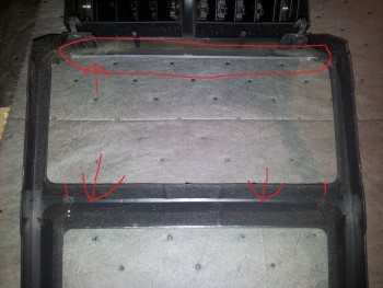 though as most of us know the radio opening in the dash is big enough to accommodate a double din radio, but the trim plate is only a din and 1/2 opening. so whats a guy or gal to do. here is what i did. after removing the face/trim plate. i had to figure out the centering of the radio to the face plate. best way i saw was to have the new radio in and see were i would need to trim. which i marked in this pic. <br />i trimmed the excess at the upper and lower ribs of the trim plate. now granted this wont be the same for all radios. this is just my experience.