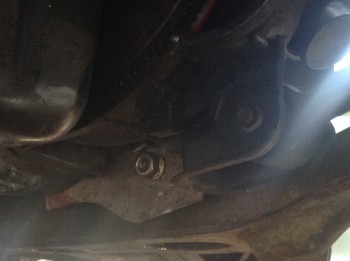 image1(2).JPG (772.84 KiB) Viewed 9778 times The tranny mount. This plate is bolted to the bottom of the Muncie out of the way. The large bolt (from the original mount of an older Beretta) is pinned-down on the other end by a rubber-coated aluminum saddle that is in turn bolted to the subframe.