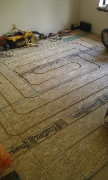 Second layer of 3/4 subfloor paneling -adds strength, rigidity, and a place for a 5/8-inch deep channel...