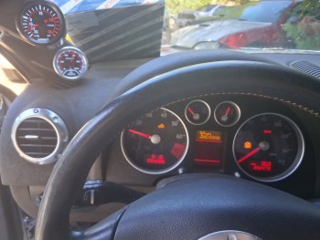 Dimmer-knob is unobtrusive and works perfectly.  I already had the varistor, so it was a cheap upgrade to the function.  Had I paid better attention, perhaps I could have gotten a silver-bezelled boost gauge to match the oil-pressure gauge and the main cluster gauges better, but ehh.